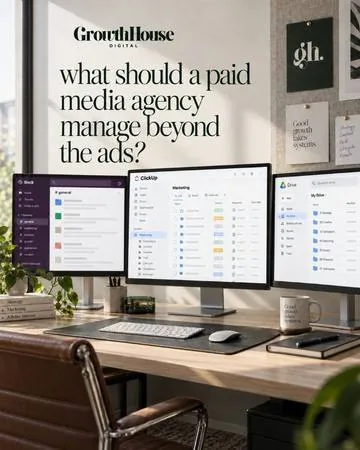 Paid media agency workspace with campaign dashboards on two monitors